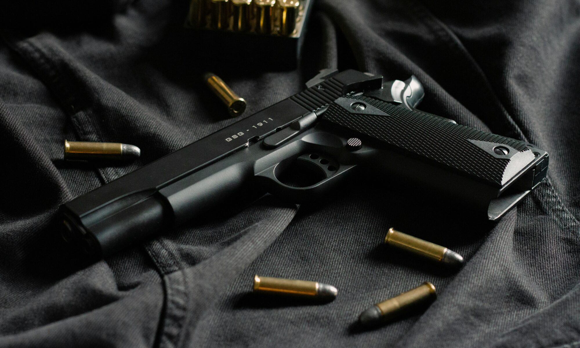 black gun with ammo