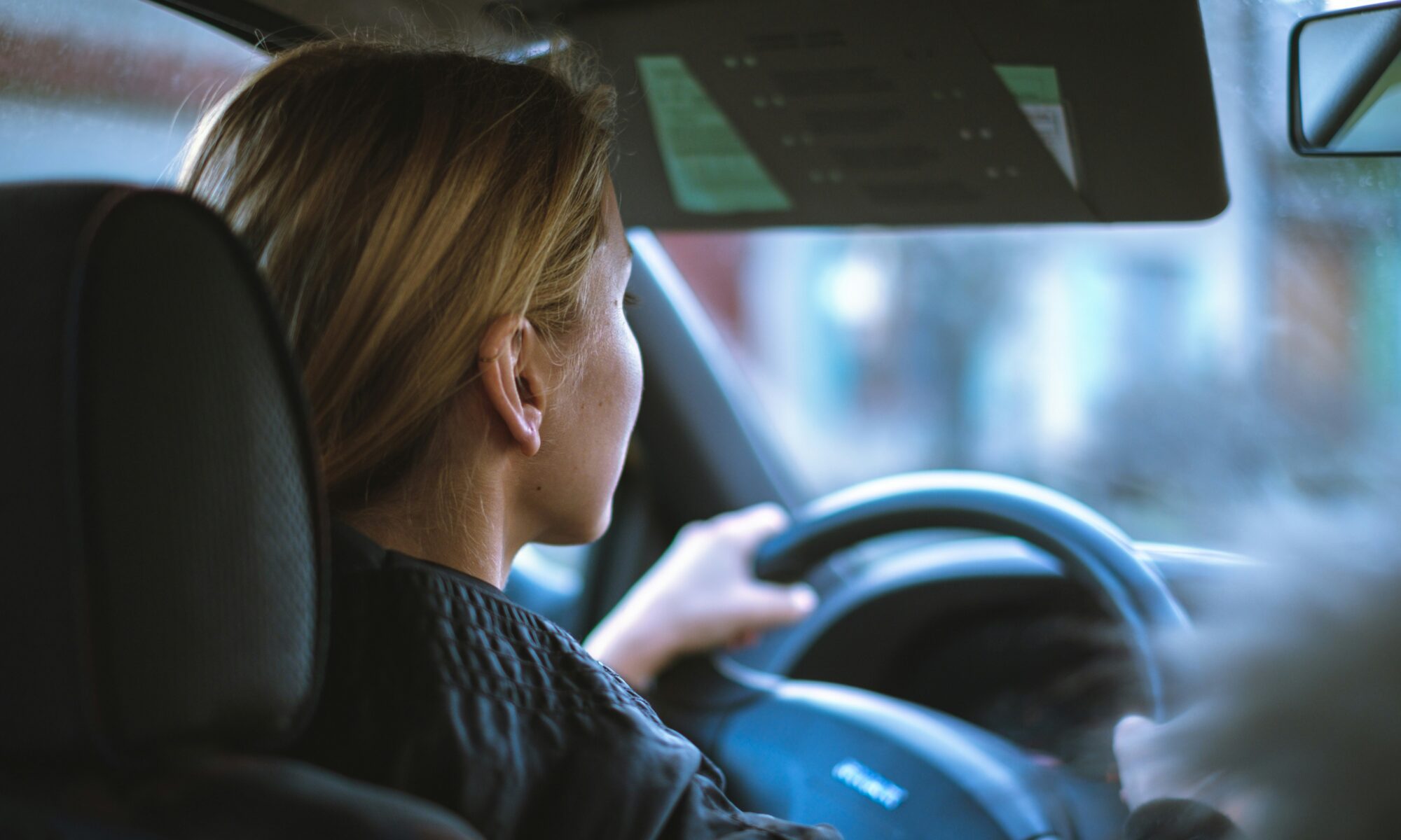 close up shot of a woman driving